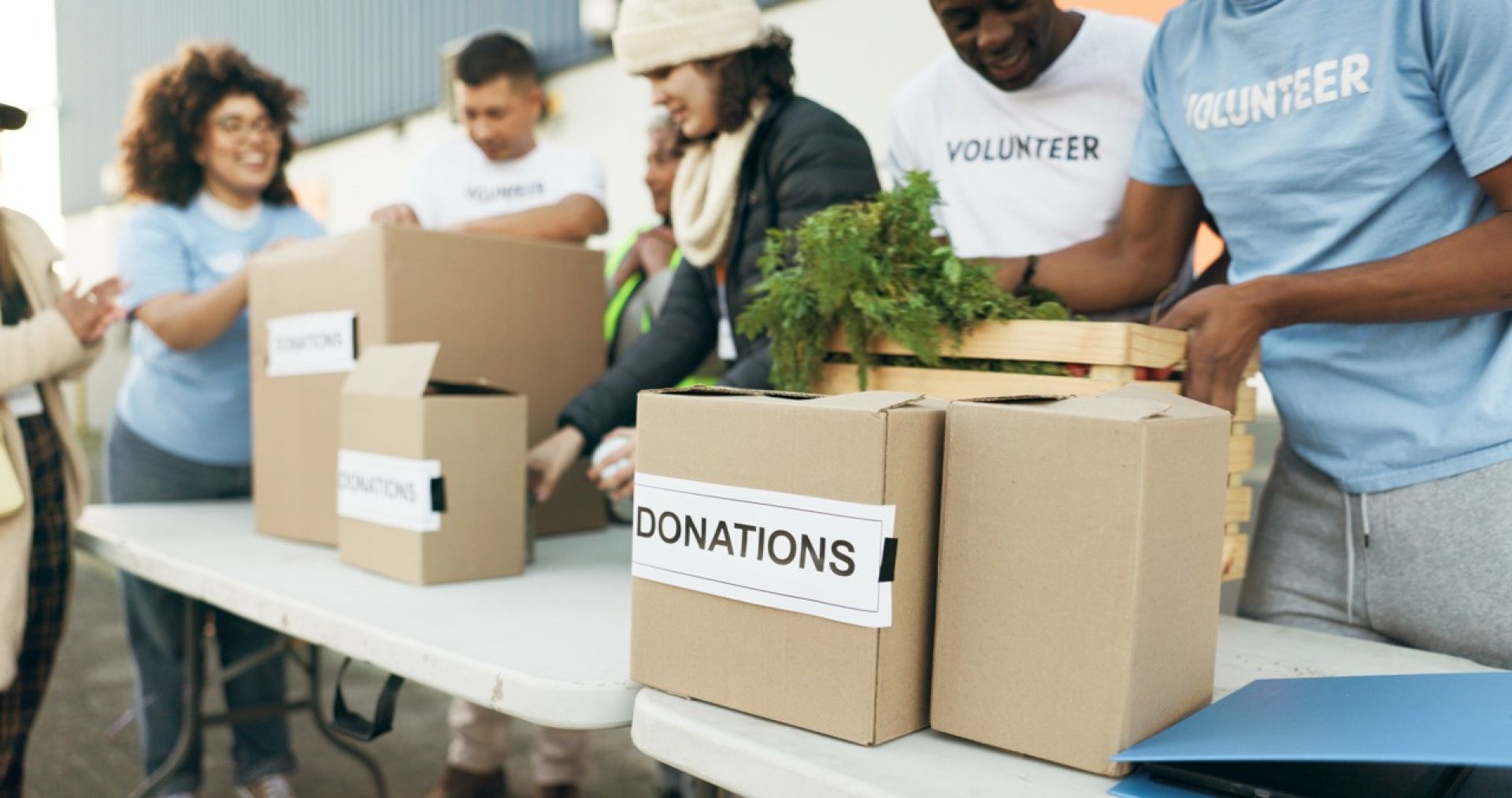 School kids engaging with their local community by volunteering to help with donations.